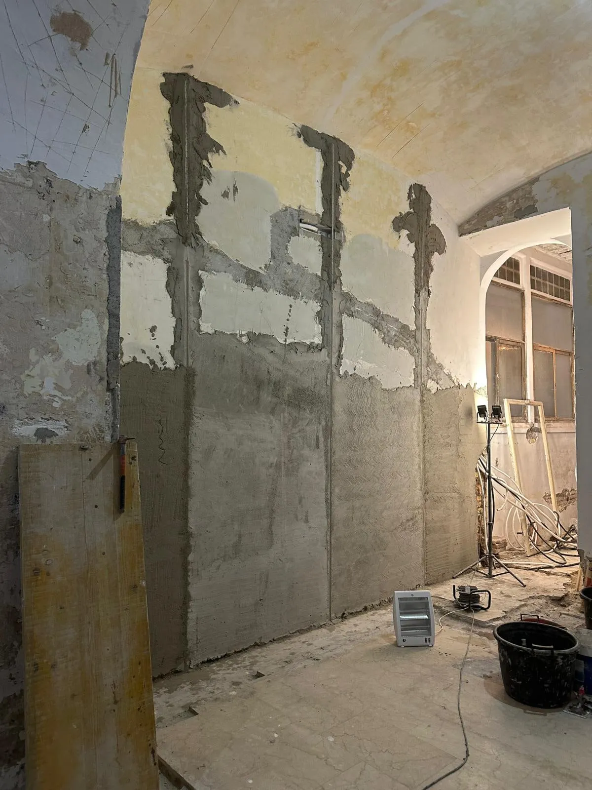 Christina Roma — the vaulted shell before restoration, plaster stripped to the brick