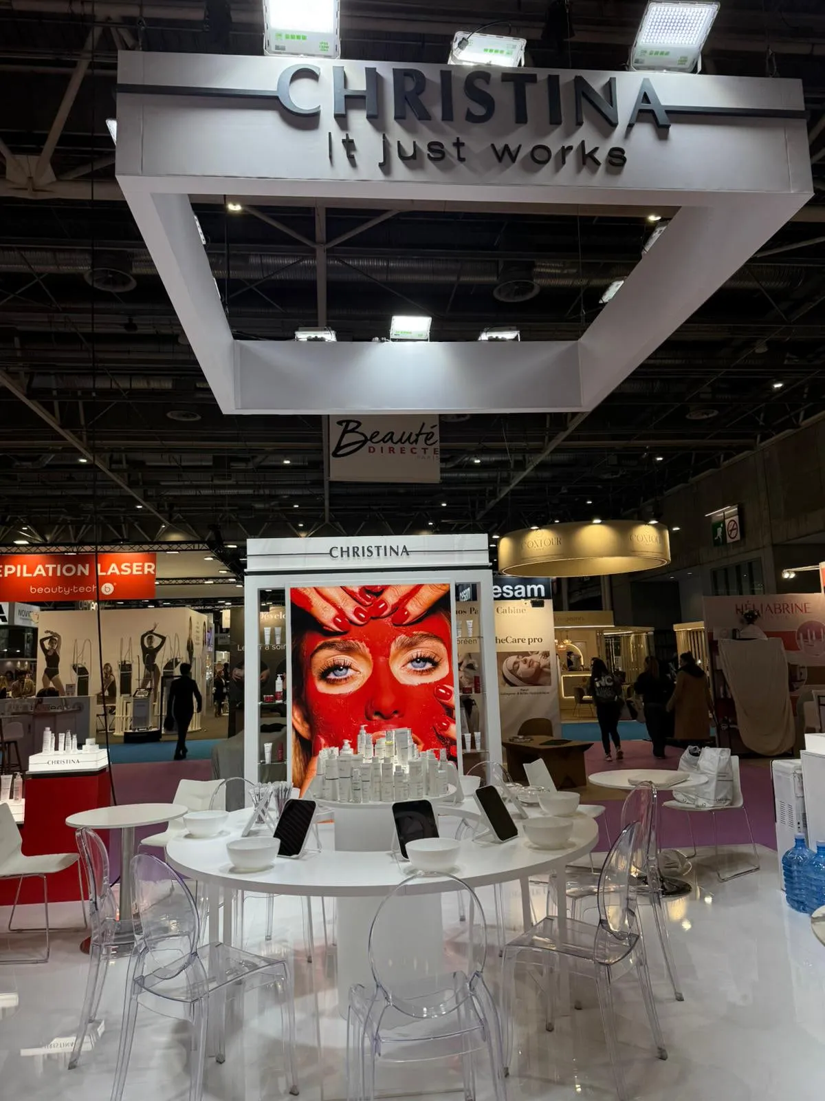 Paris 2026 — the stand with its suspended lighting rig and campaign wall