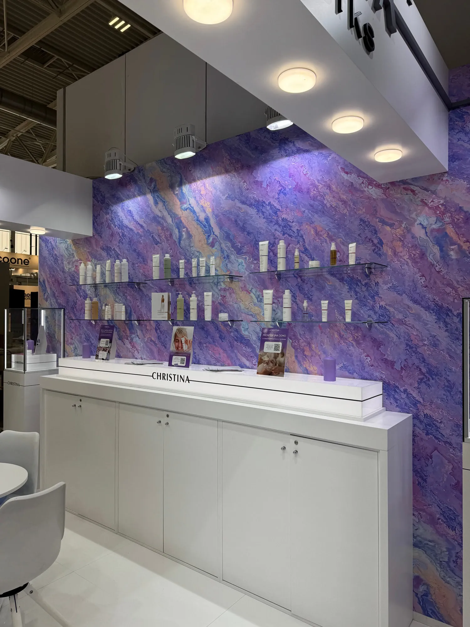 Bologna 2025 — the exhibition stand wrapped in a violet quartzite graphic