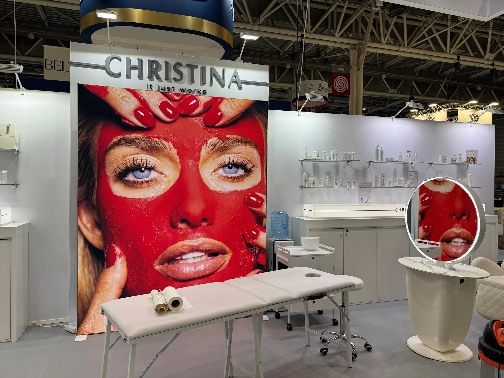 Paris 2025 — campaign wall and treatment stations on the stand