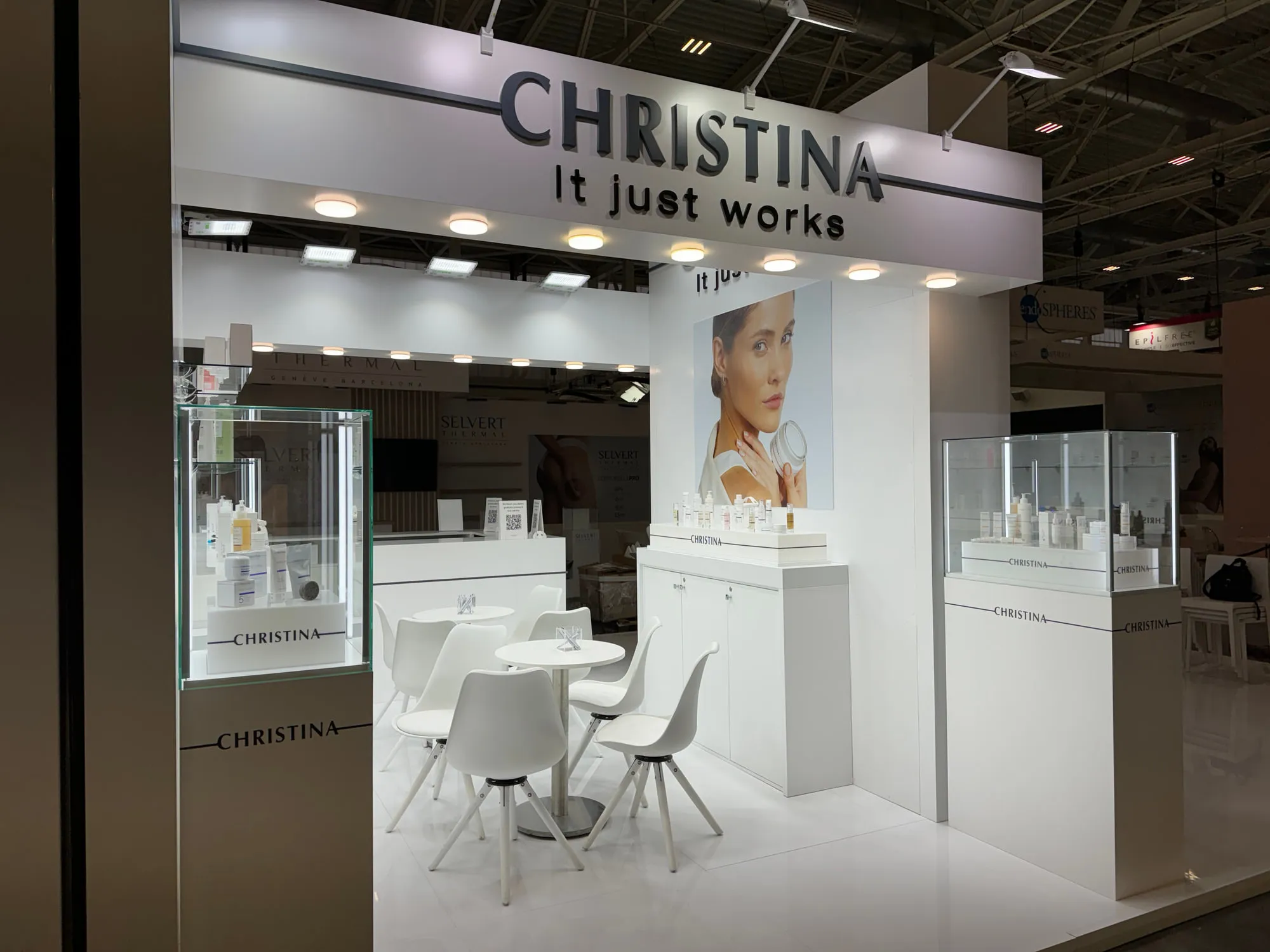 Bologna 2024 — white stand with glass display cases