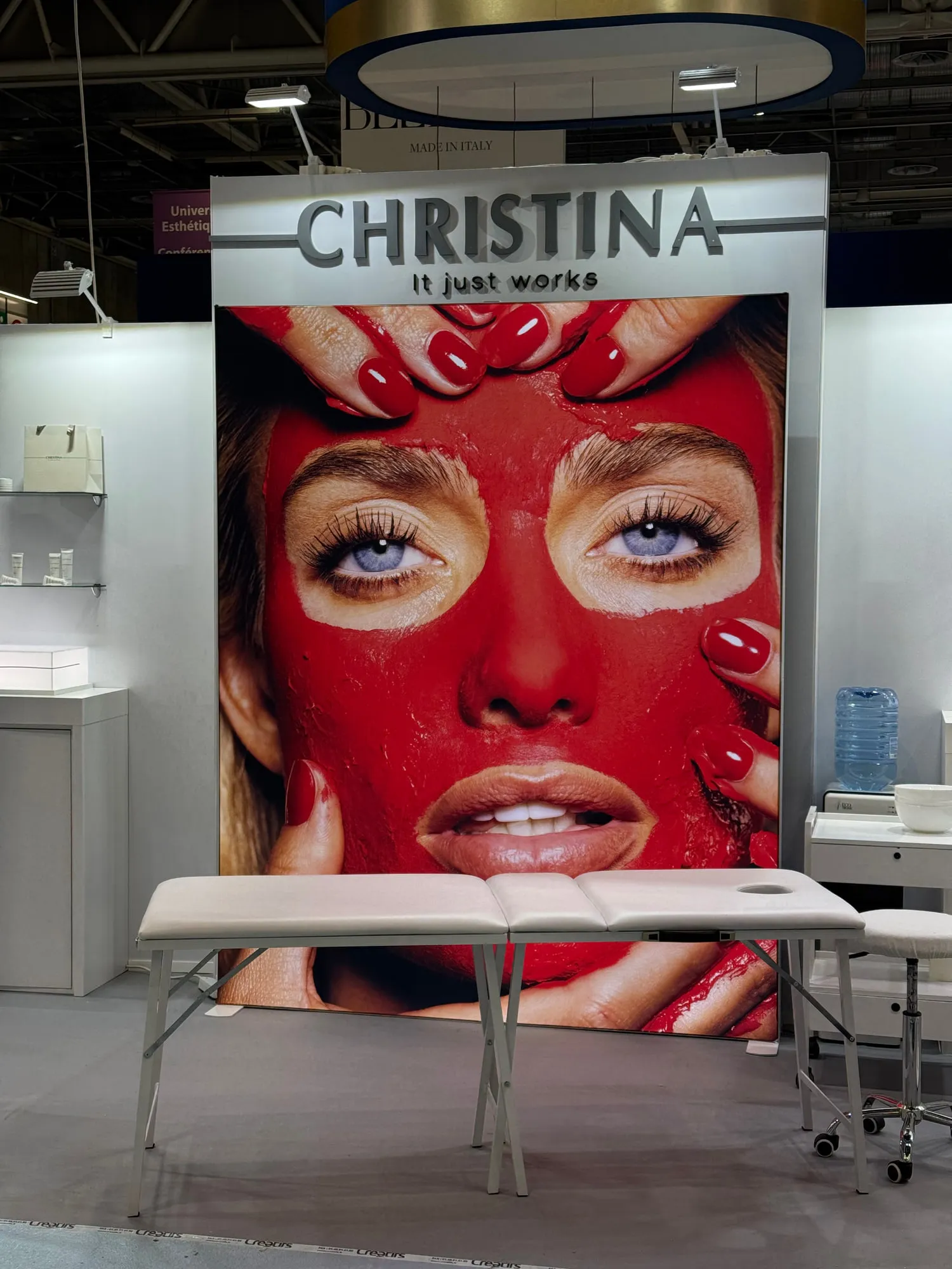 Paris 2025 — campaign wall and treatment stations on the stand