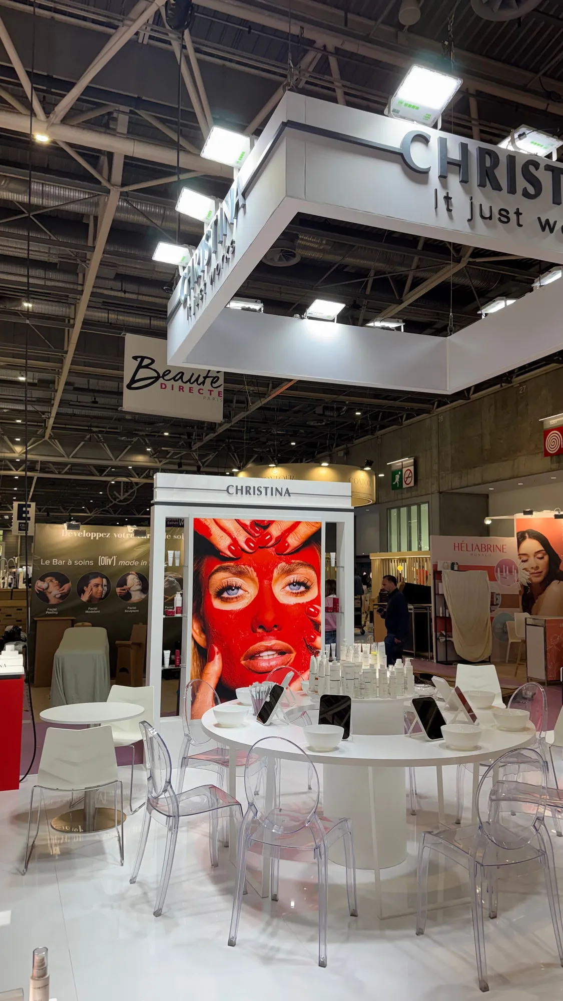 Paris 2026 — the stand with its suspended lighting rig and campaign wall