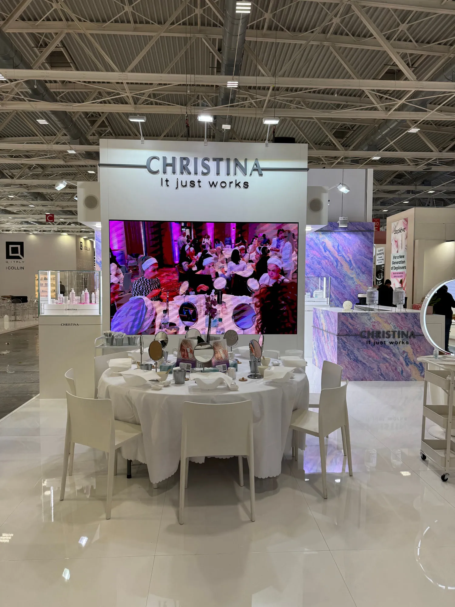 Bologna 2025 — the exhibition stand wrapped in a violet quartzite graphic