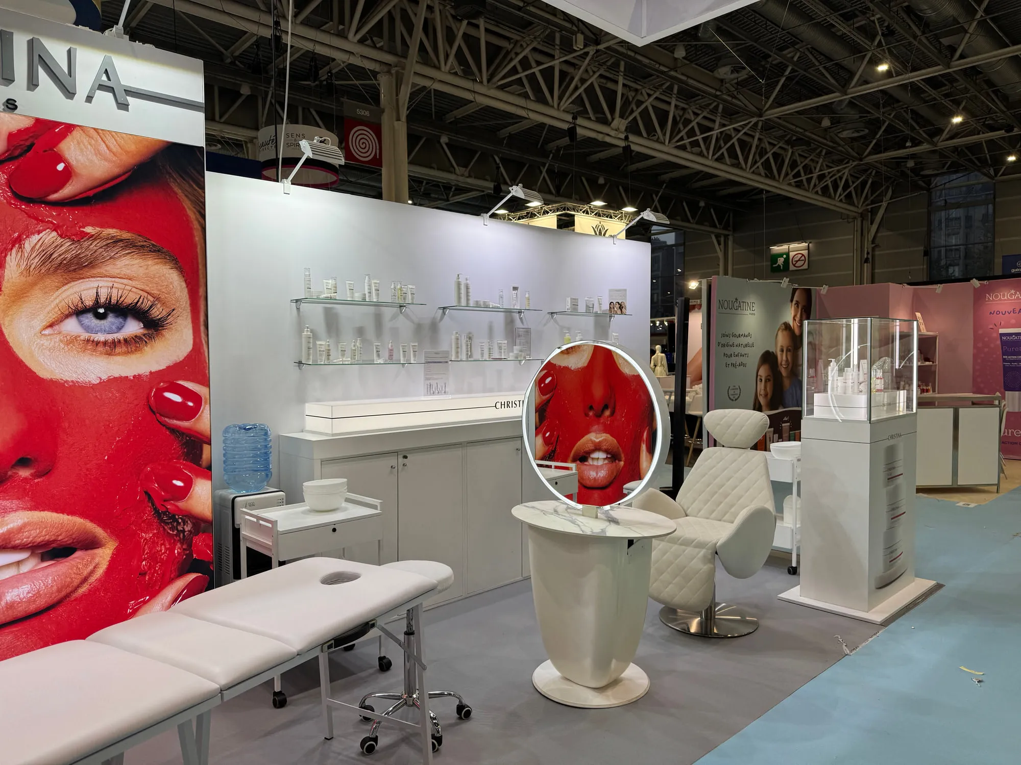 Paris 2025 — campaign wall and treatment stations on the stand