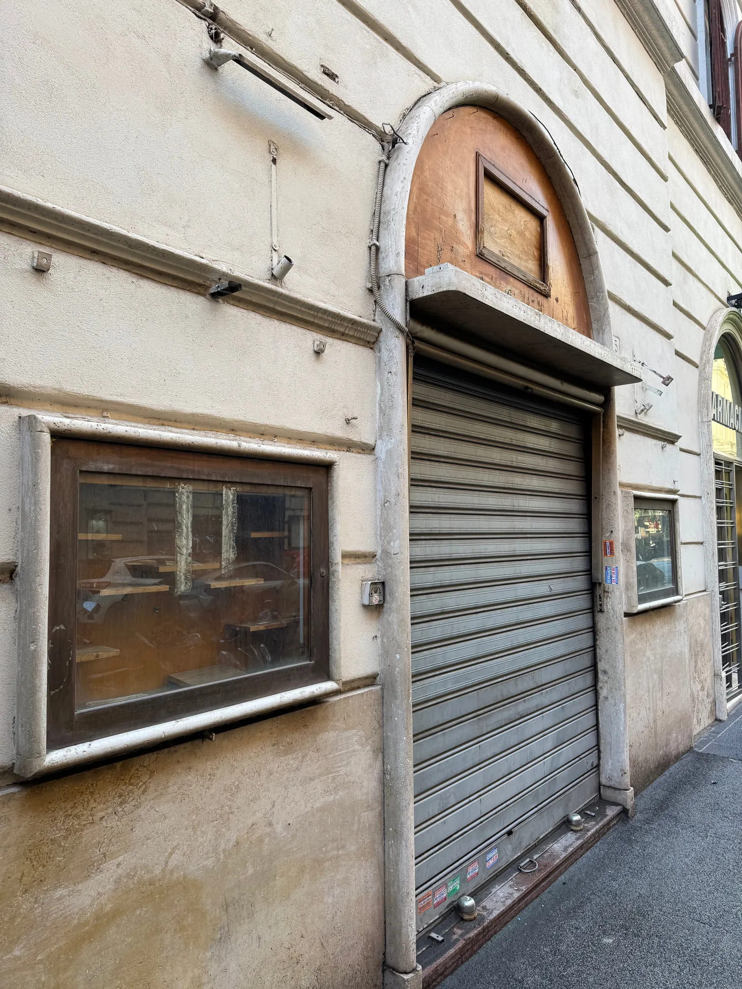 Before — The arched shopfront, before and after