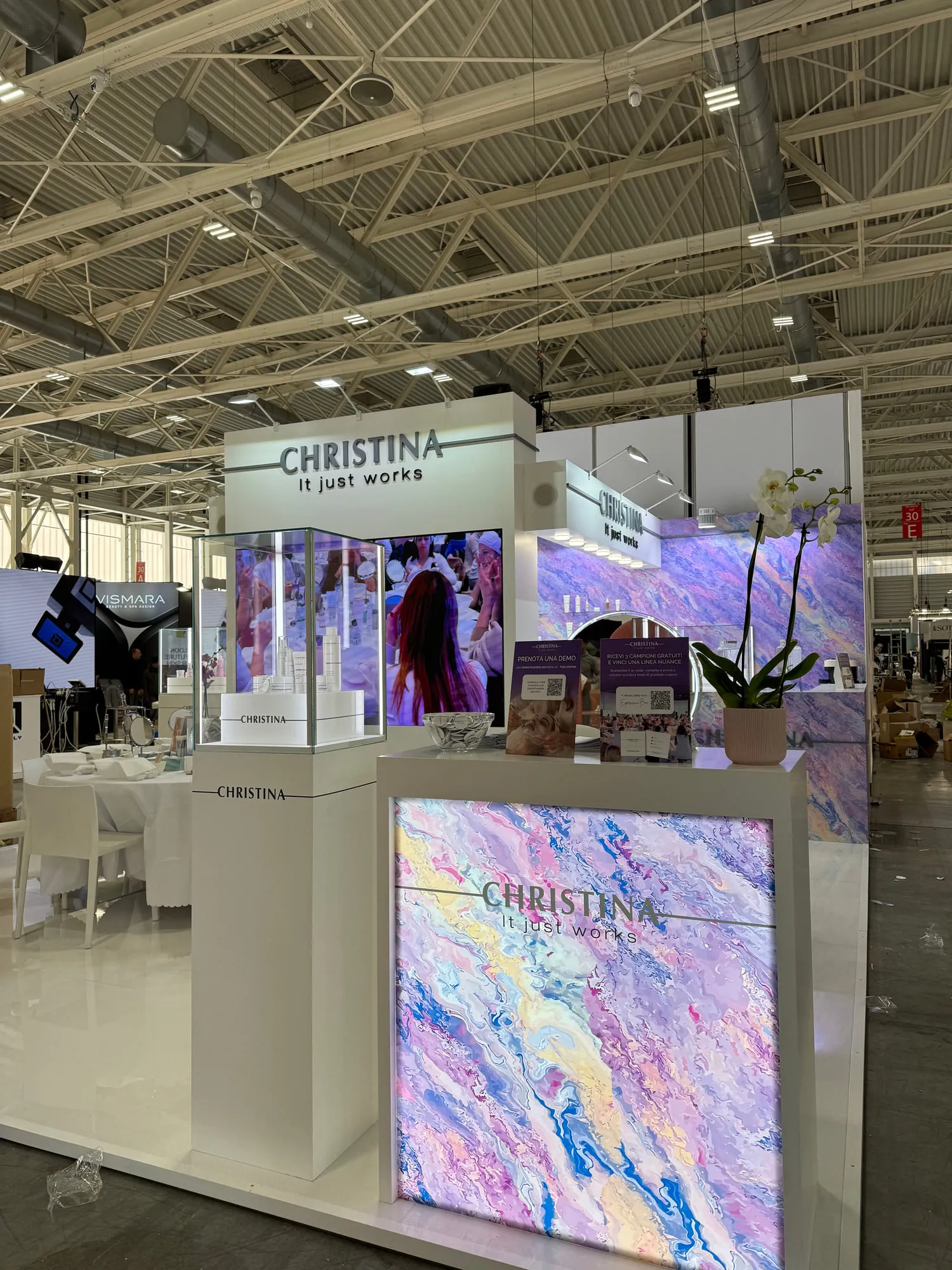 Bologna 2025 — the exhibition stand wrapped in a violet quartzite graphic