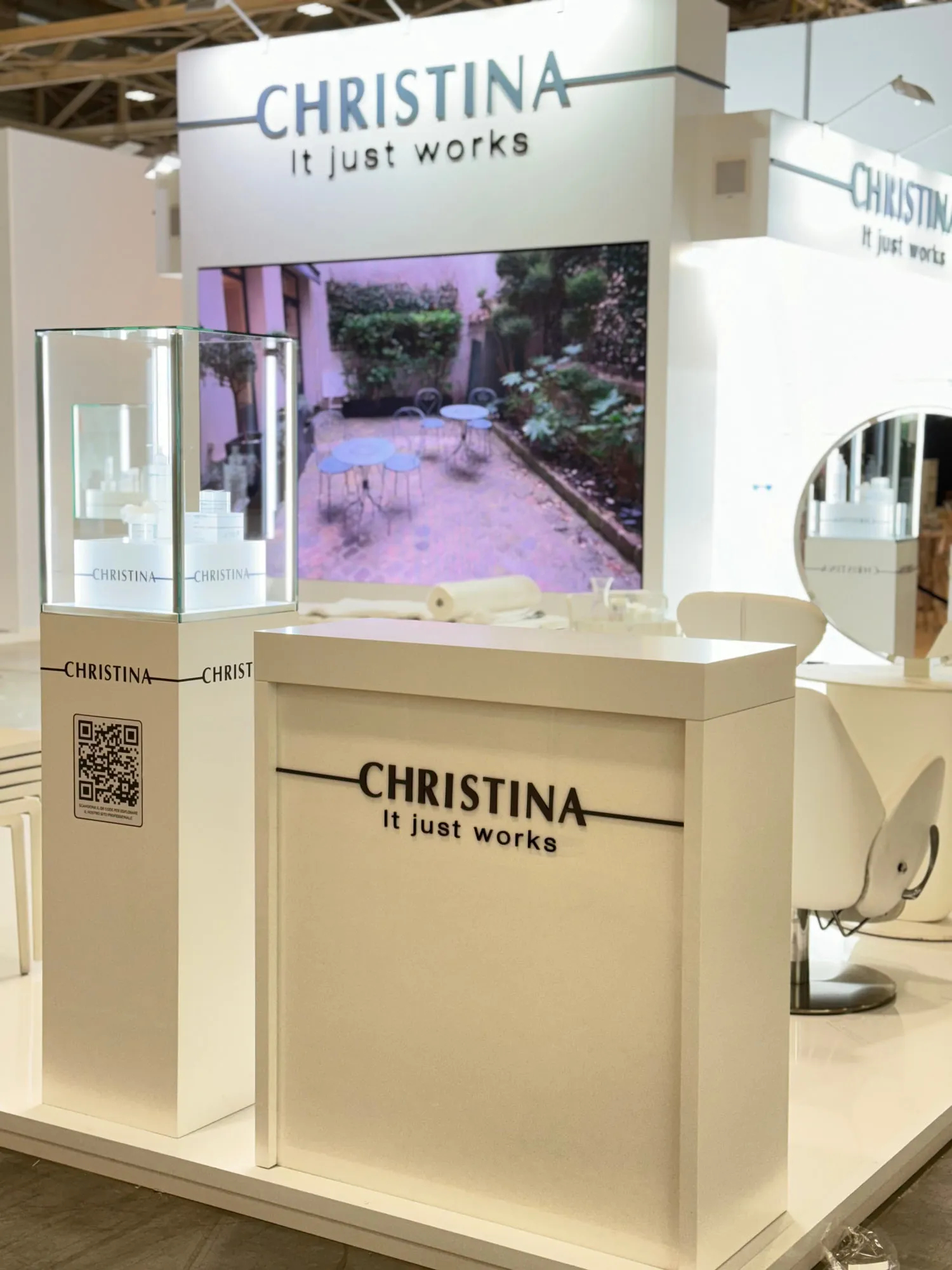 Bologna 2024 — white stand with glass display cases