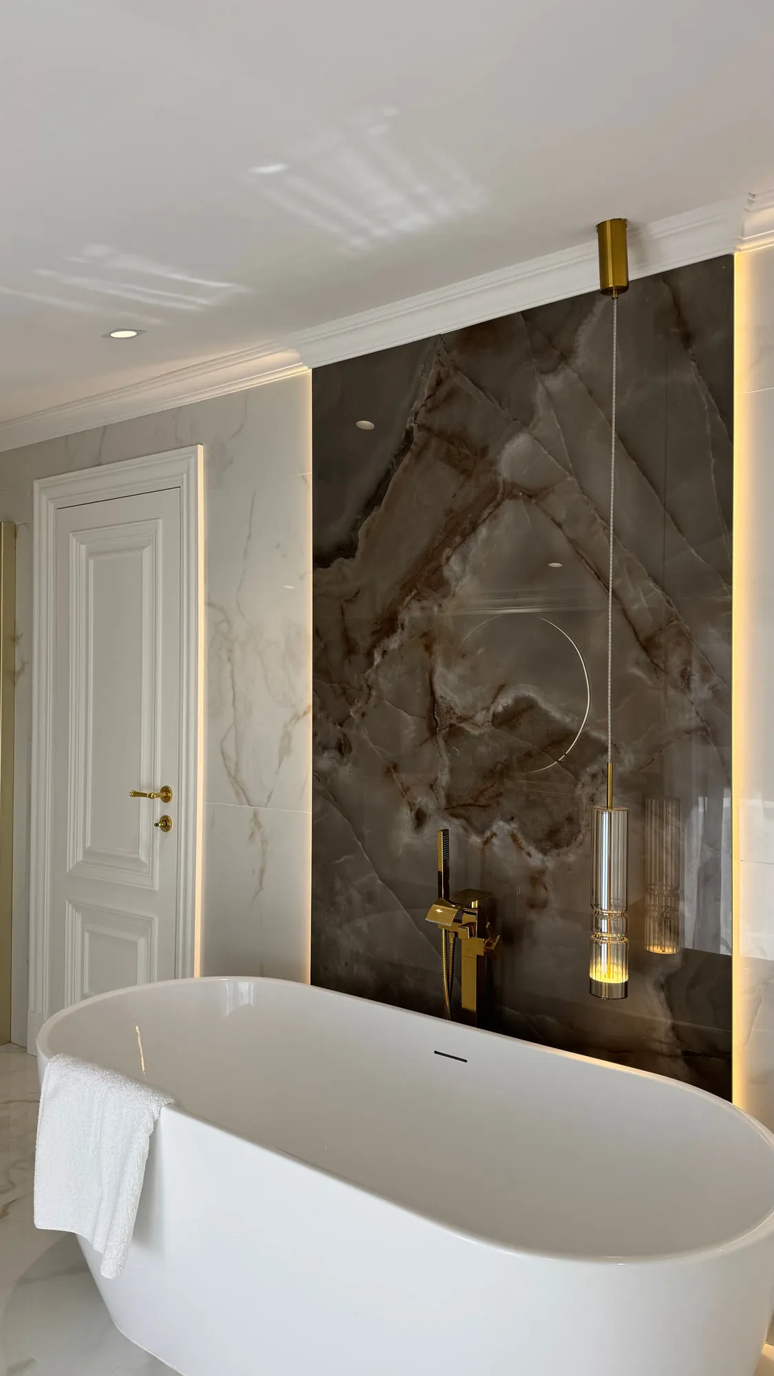 La Villa — marble, brass and lacquered joinery in the finished villa
