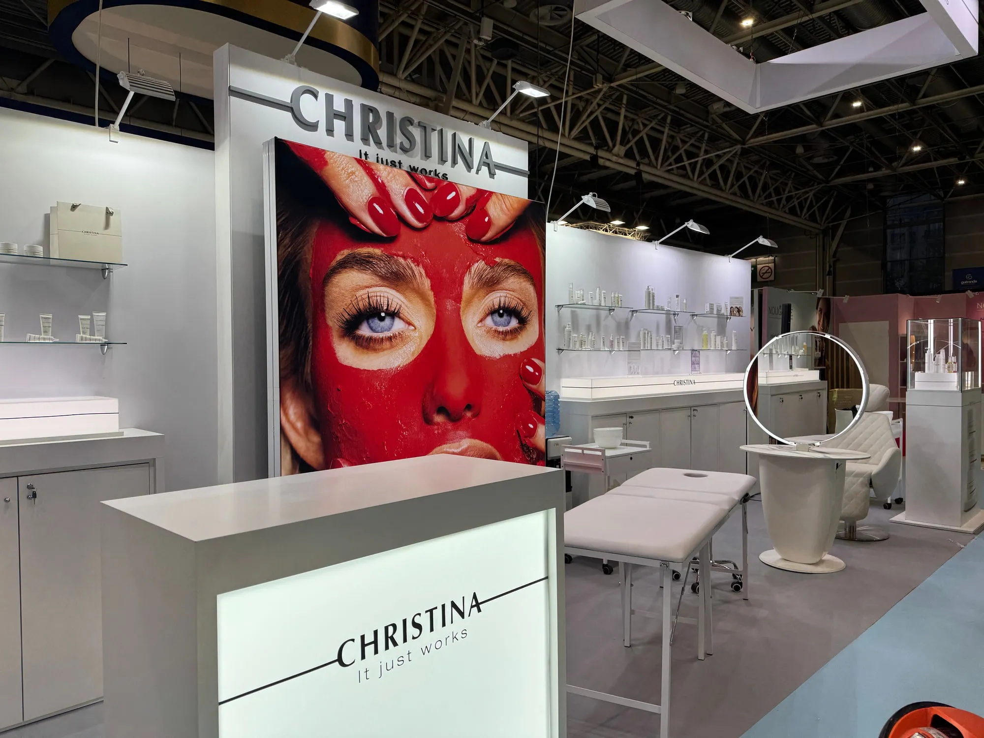 Paris 2025 — campaign wall and treatment stations on the stand