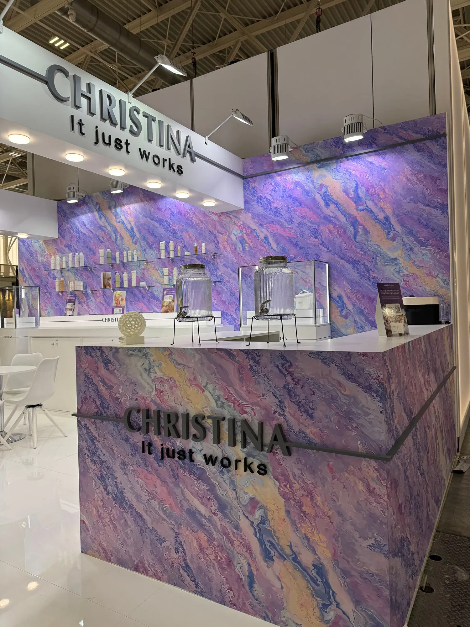 Bologna 2025 — the exhibition stand wrapped in a violet quartzite graphic