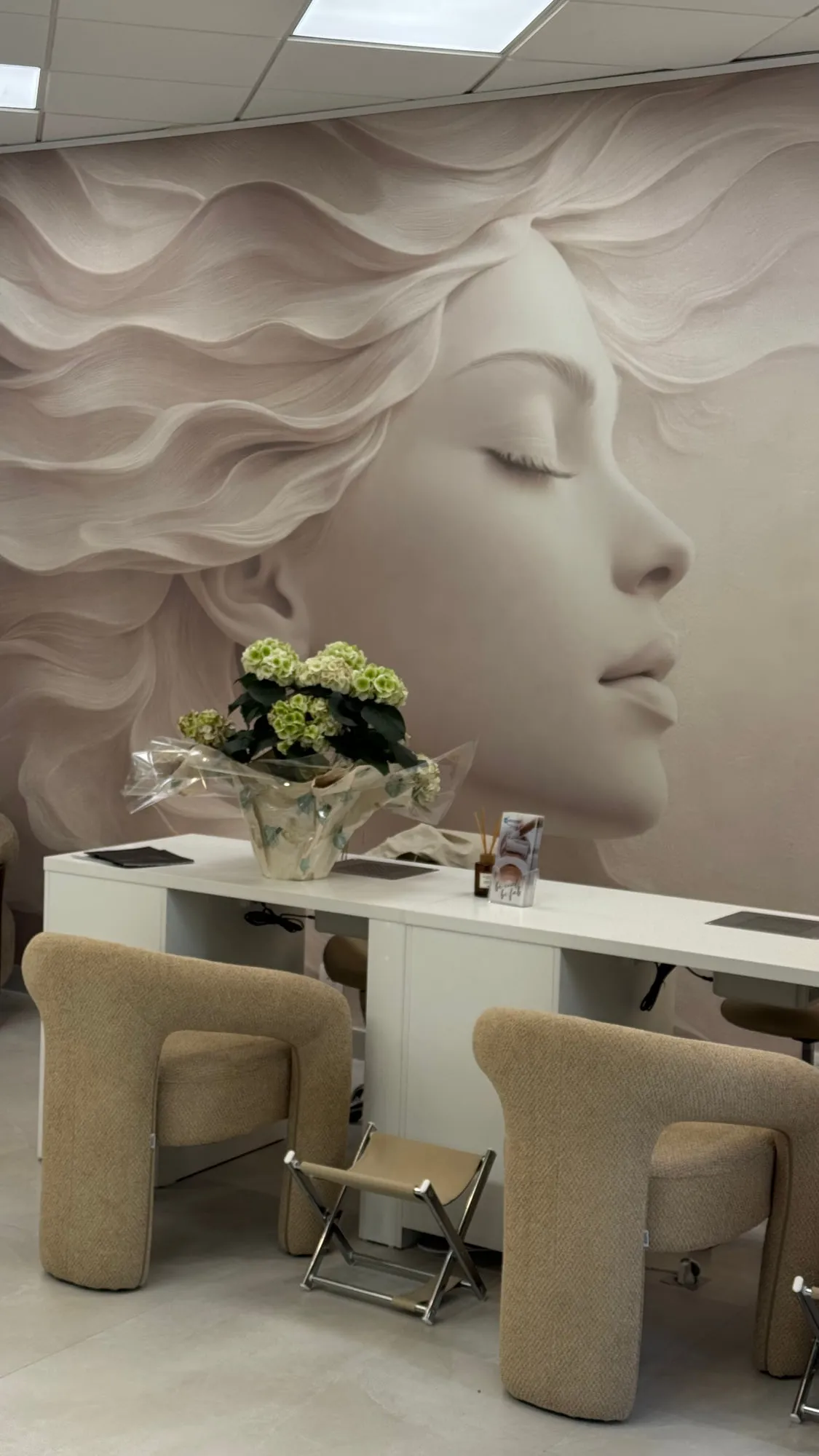 Larimar — the sculpted plaster face behind the styling stations