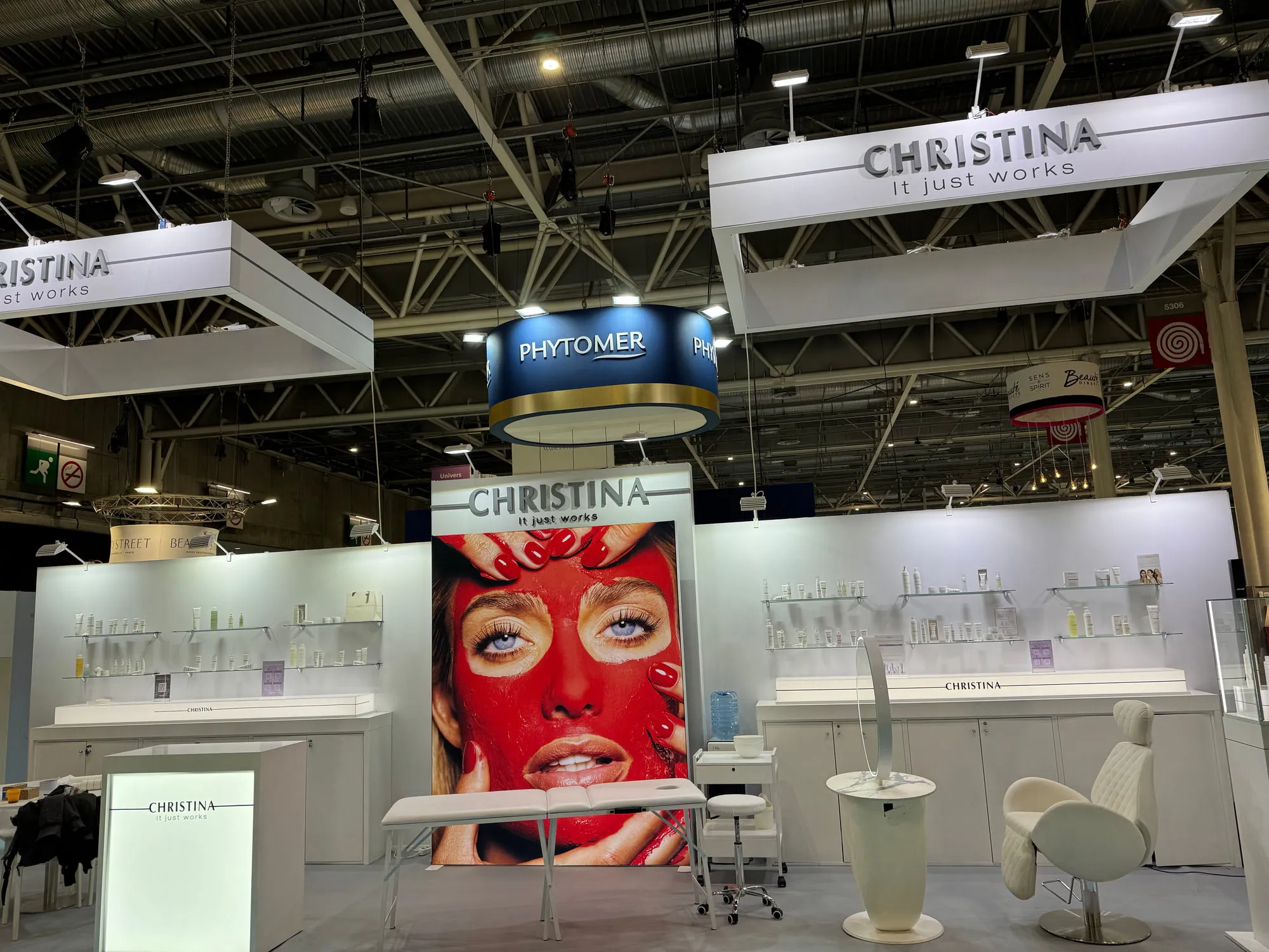 Paris 2025 — campaign wall and treatment stations on the stand