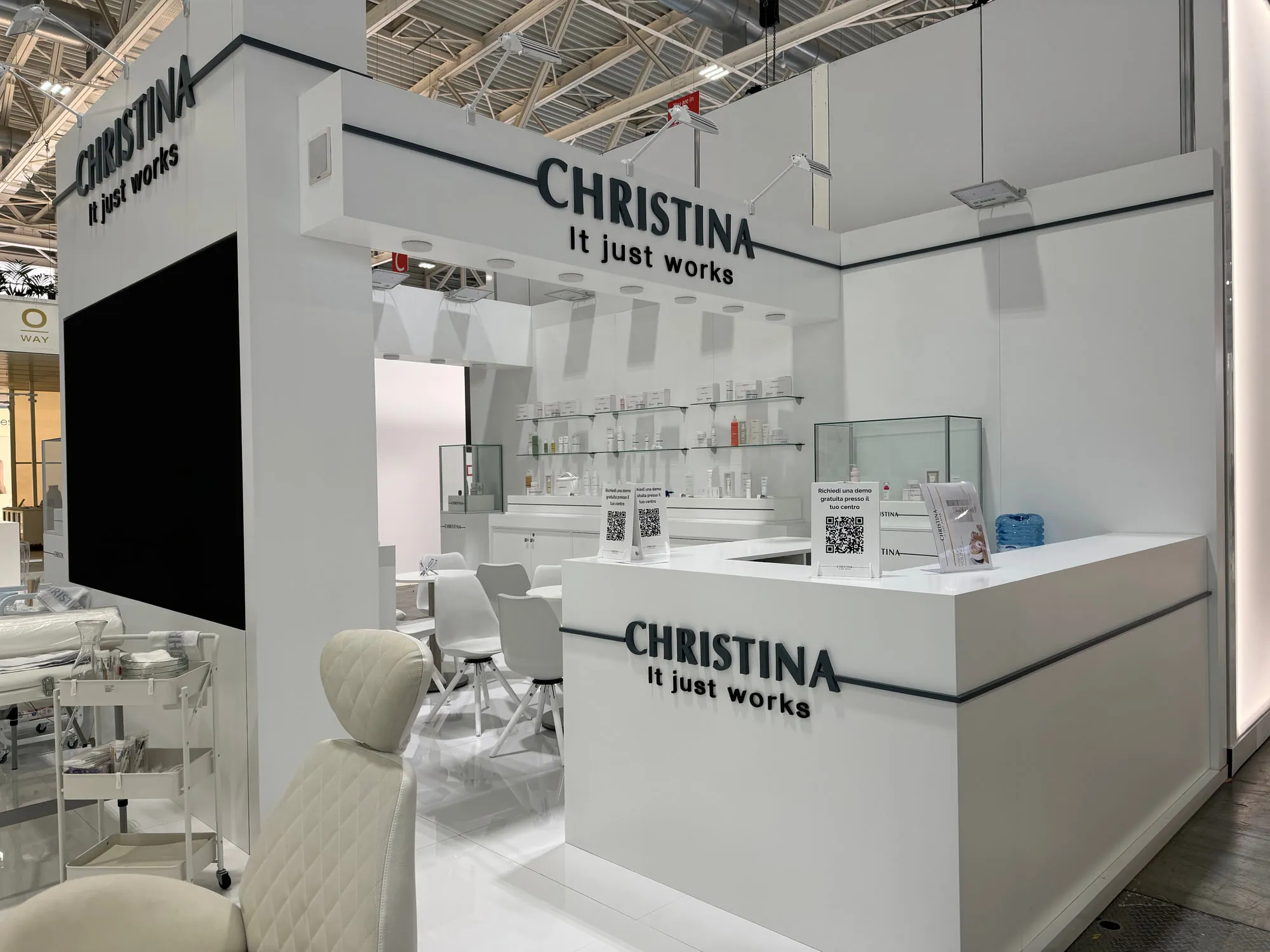 Bologna 2024 — white stand with glass display cases