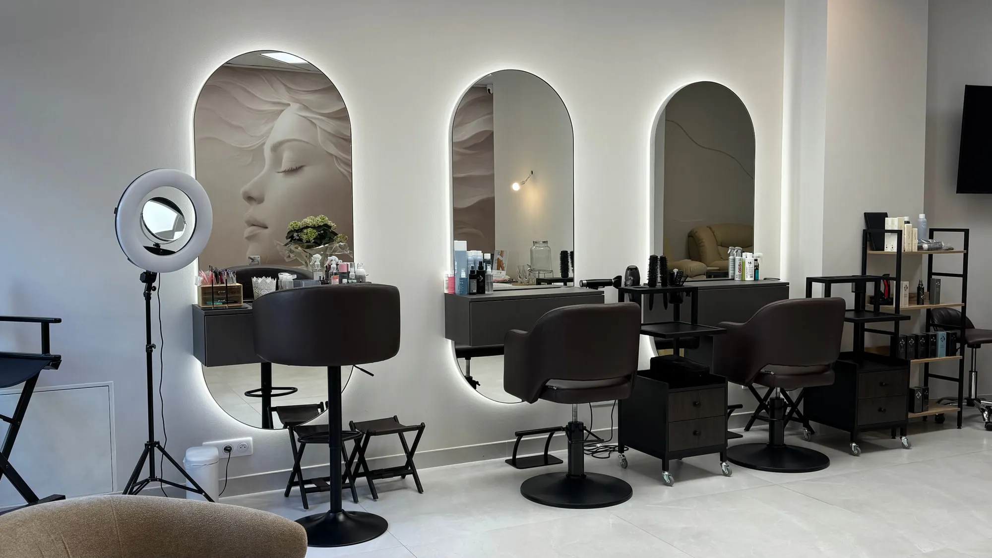 Larimar — the sculpted plaster face behind the styling stations