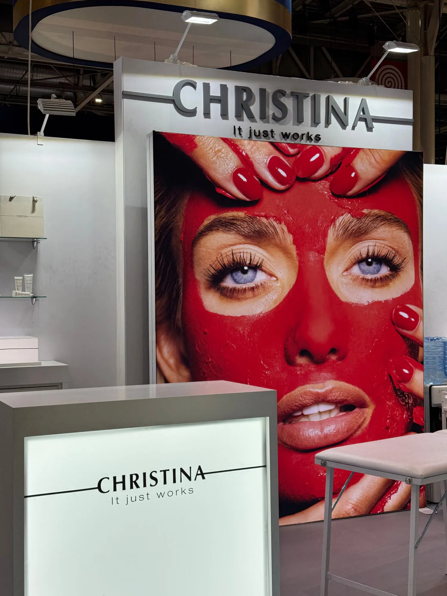 Paris 2025 — campaign wall and treatment stations on the stand