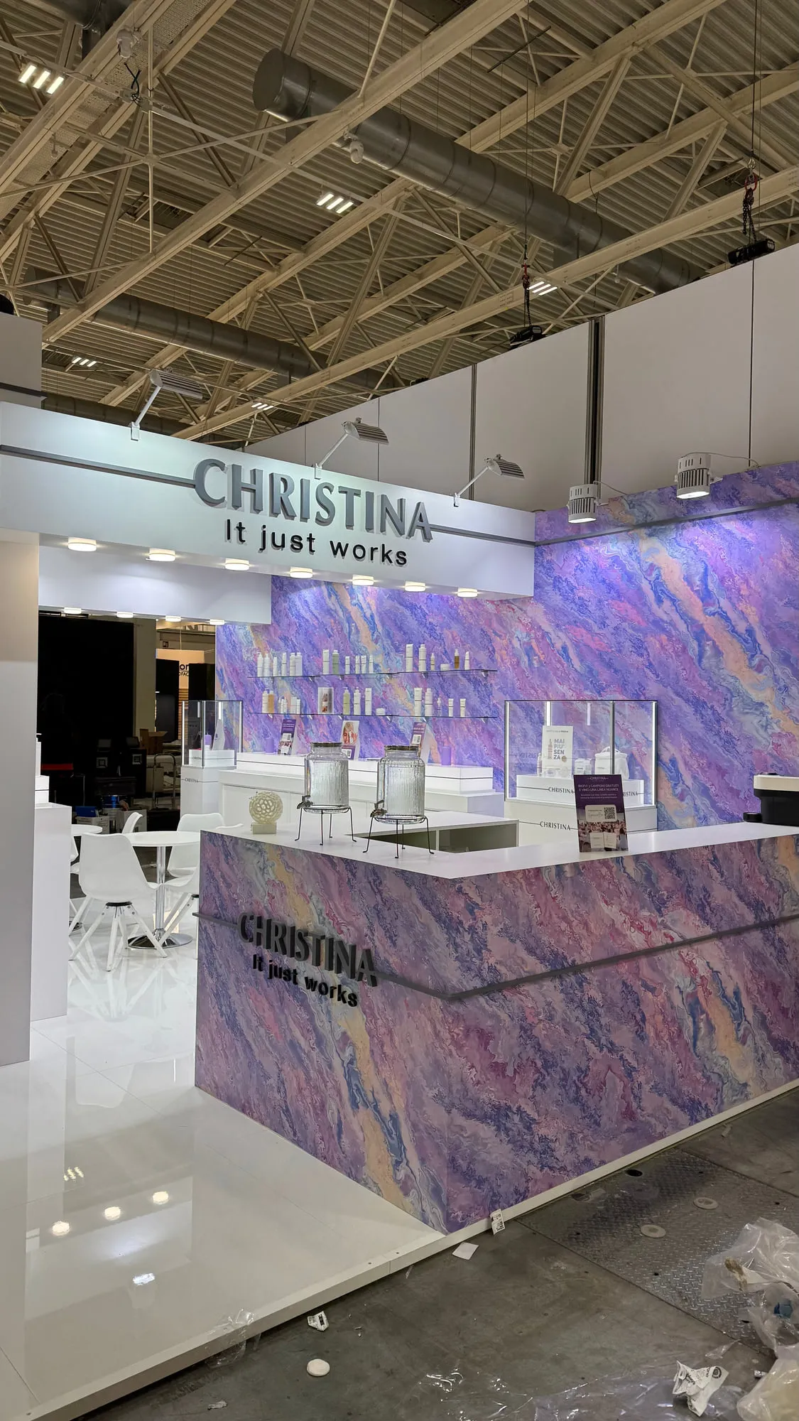 Bologna 2025 — the exhibition stand wrapped in a violet quartzite graphic