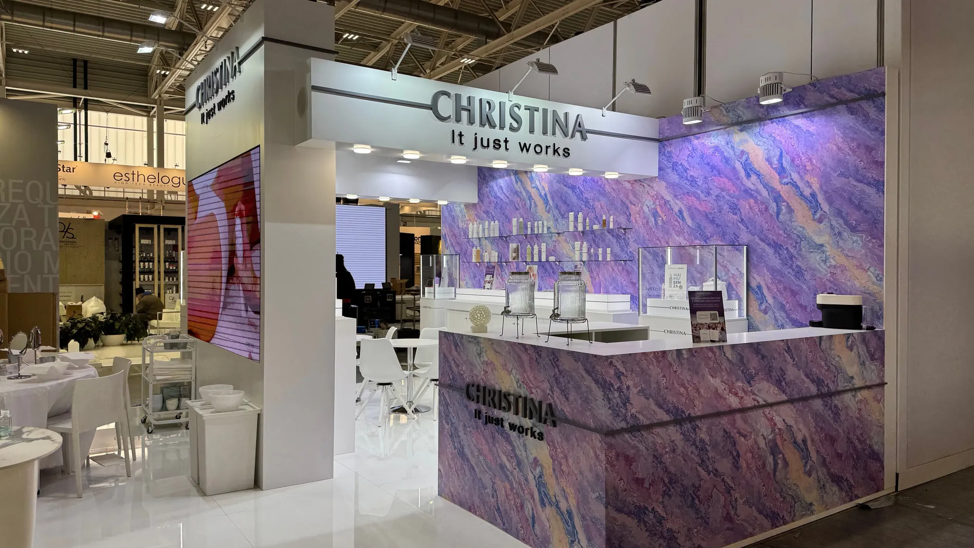 Bologna 2025 — the exhibition stand wrapped in a violet quartzite graphic
