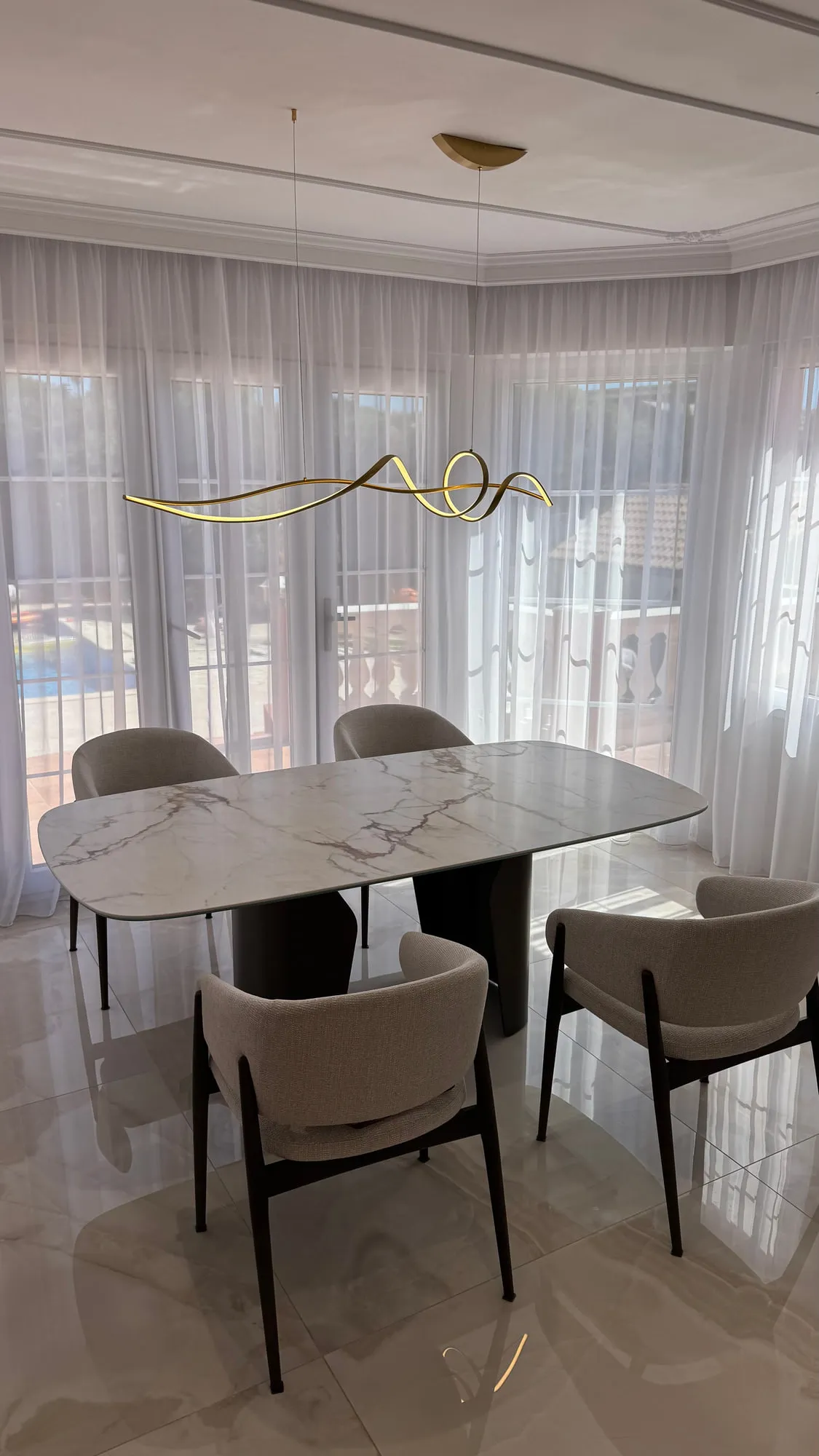 La Villa — marble, brass and lacquered joinery in the finished villa