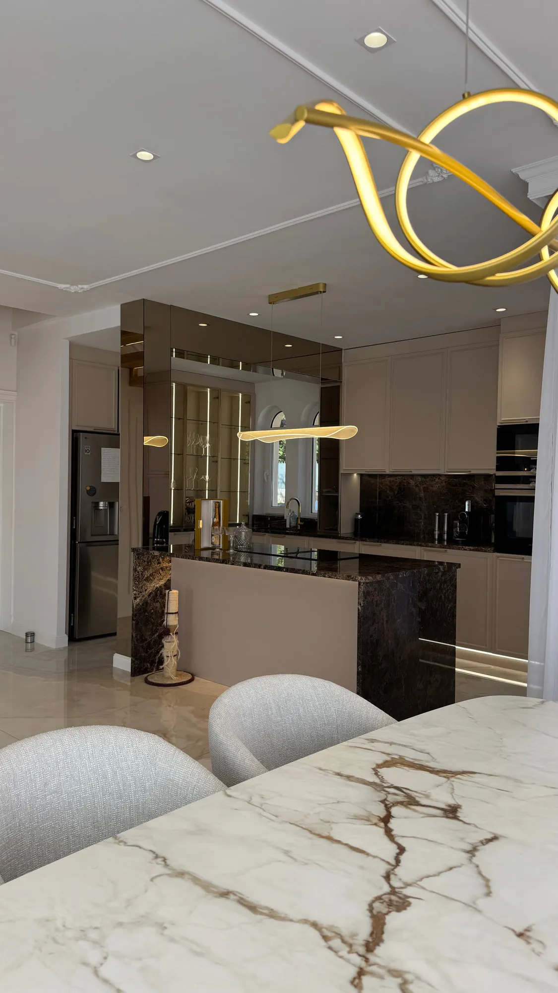 La Villa — marble, brass and lacquered joinery in the finished villa