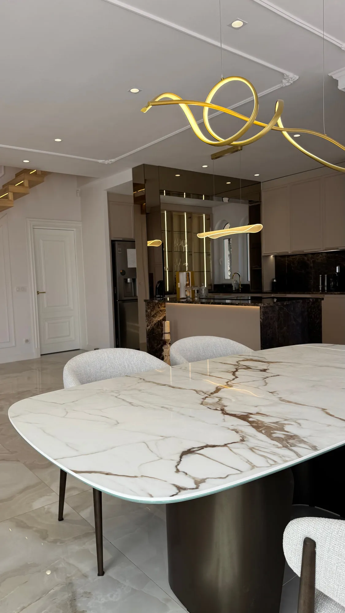 La Villa — marble, brass and lacquered joinery in the finished villa