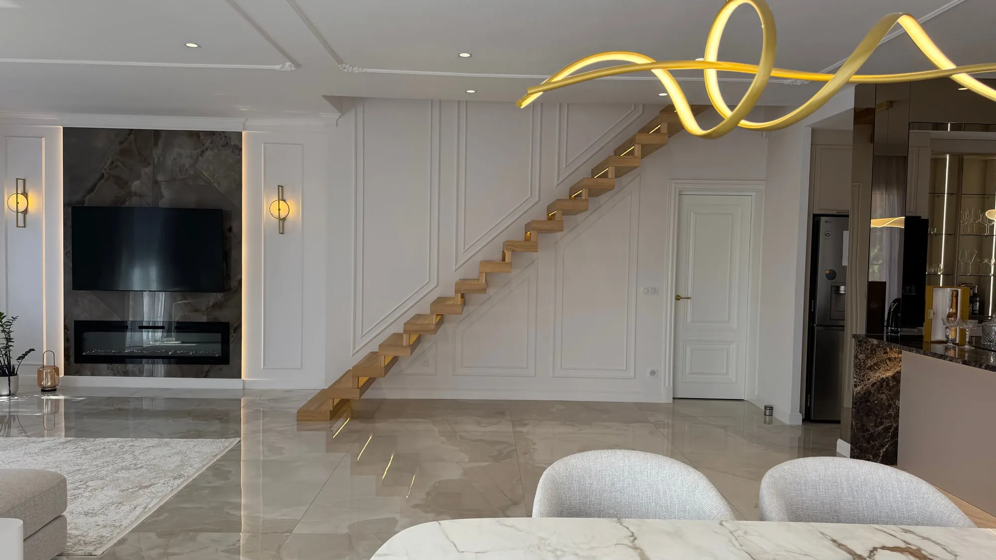 La Villa — marble, brass and lacquered joinery in the finished villa