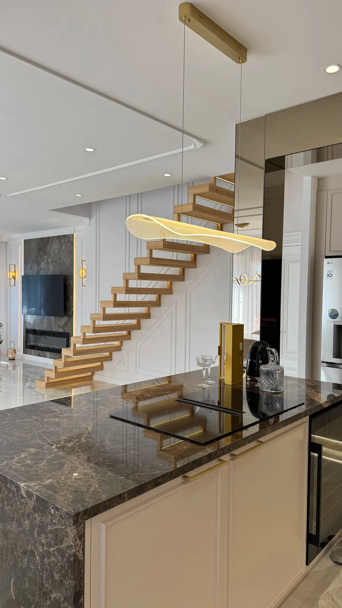 La Villa — marble, brass and lacquered joinery in the finished villa