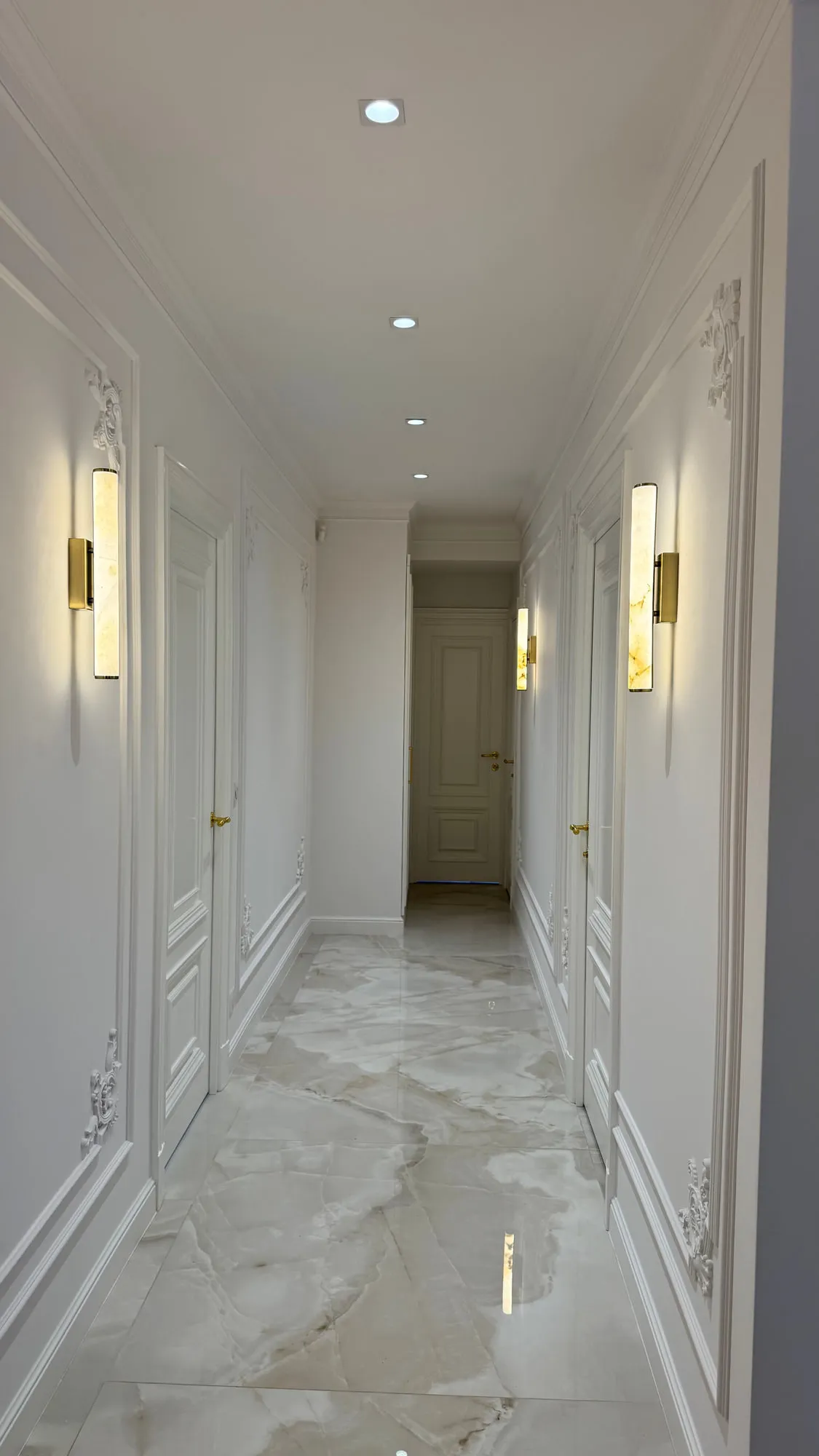 La Villa — marble, brass and lacquered joinery in the finished villa