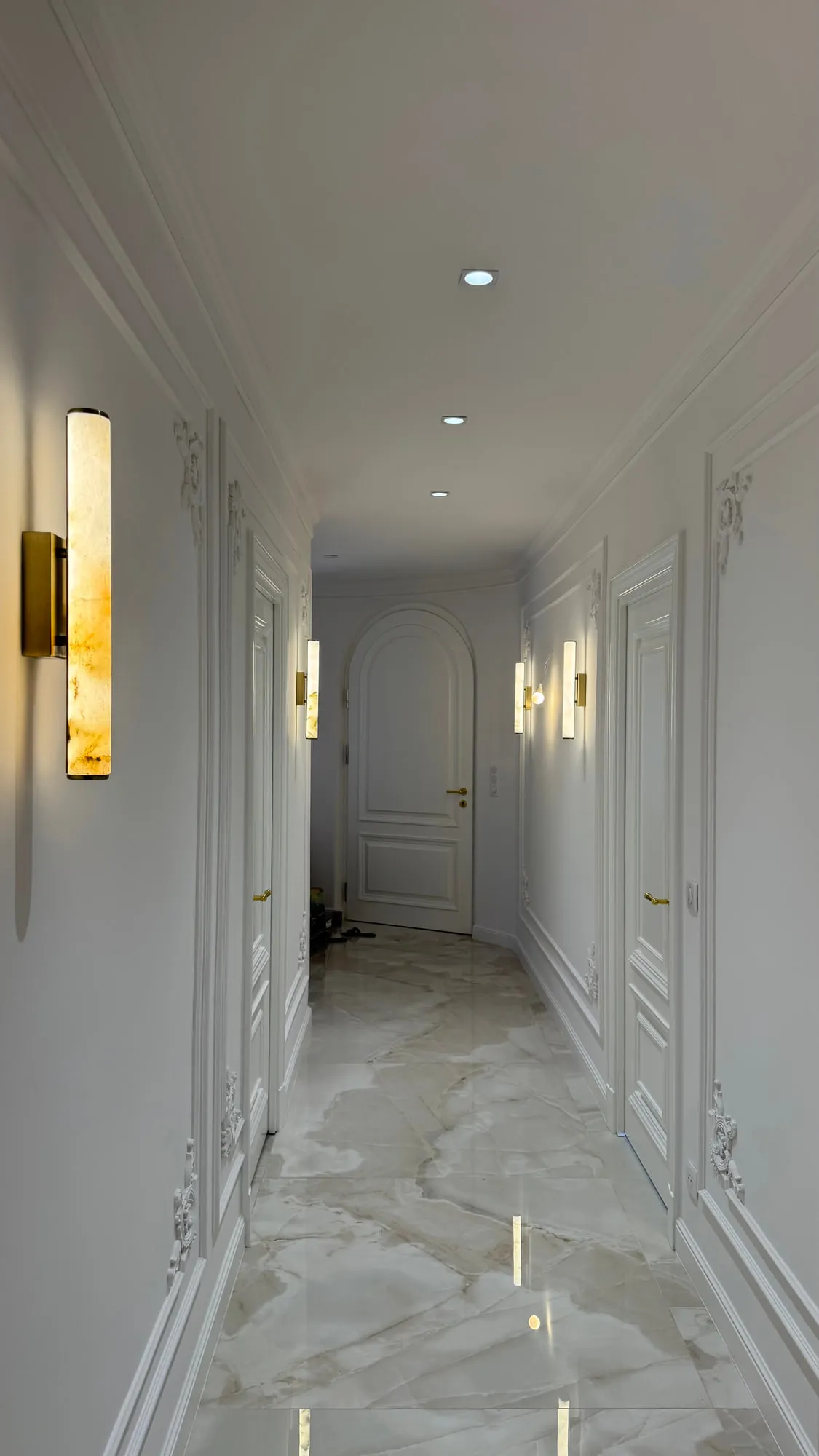 La Villa — marble, brass and lacquered joinery in the finished villa